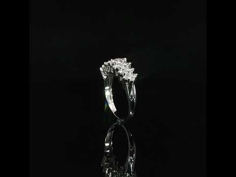 Polished gold shoulder beside the multi-row diamond setting of a 14K white gold anniversary ring.