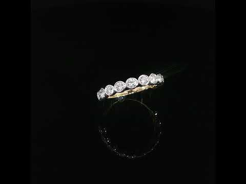 Stackable 14K yellow gold diamond ring featuring a row of bezel set round lab grown diamonds with D–F color and VS–VVS clarity.