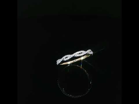 Yellow gold diamond ring with elongated openwork loops and a polished inner band, shown at a slight angle.