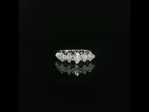 14K white gold ring with round lab-grown diamonds arranged in repeating clusters.