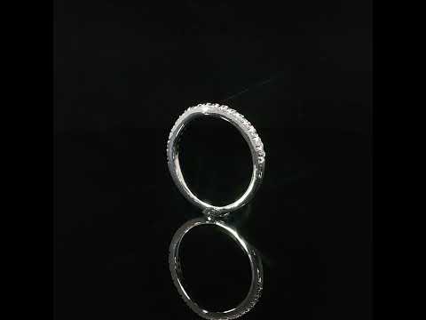 Side view of a petite 14K white gold diamond wedding band highlighting the diamond setting and slim polished shank