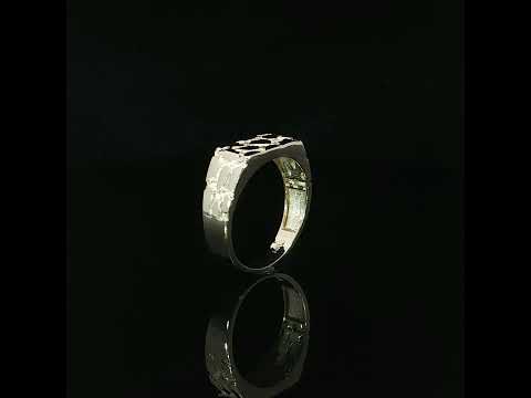 Close-up of a 14K yellow gold nugget ring featuring an abstract geometric pattern with irregular raised shapes and textured recessed detailing.