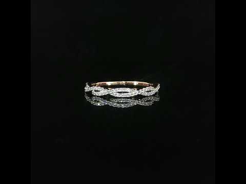 Close-up of a rose gold diamond band featuring intertwined oval-shaped links decorated with brilliant lab grown diamonds.