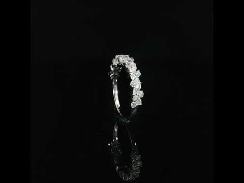 Upright view of a 14K white gold diamond ring showing its smooth shank beneath raised individual settings.