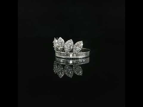 Front view of five marquise diamond crown points above a row of baguette diamonds.