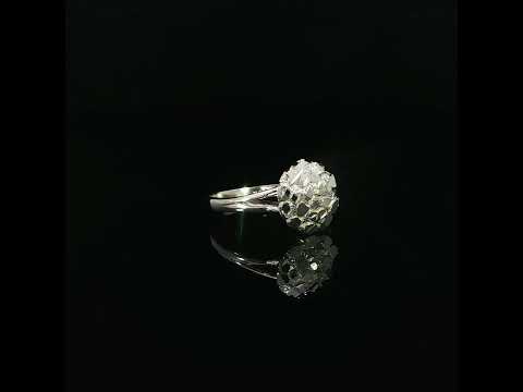 gold circle nugget ring with a raised textured top and smooth split shoulders.