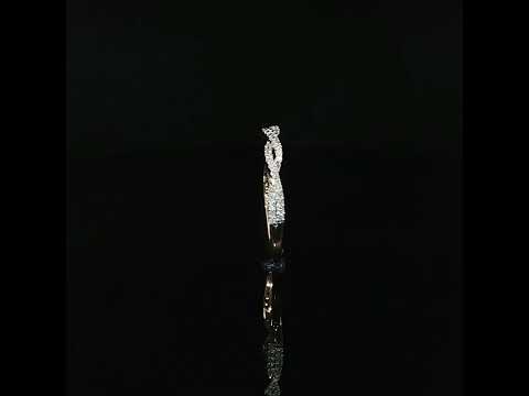 Upright side profile of a gold twist ring showing raised diamond settings and a polished lower shank.