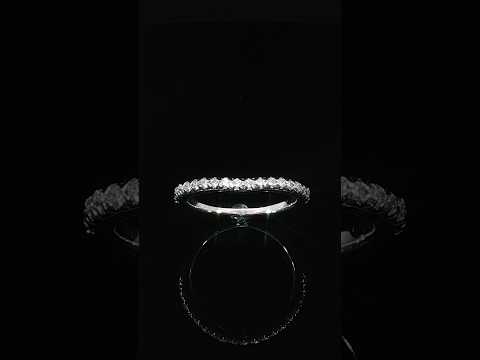 Angled profile of a 14K white gold stackable diamond band with a subtle contour and brilliant round lab grown diamonds.