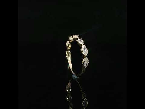 Upright marquise diamond band showing raised bezel sides and the plain polished yellow gold lower shank.