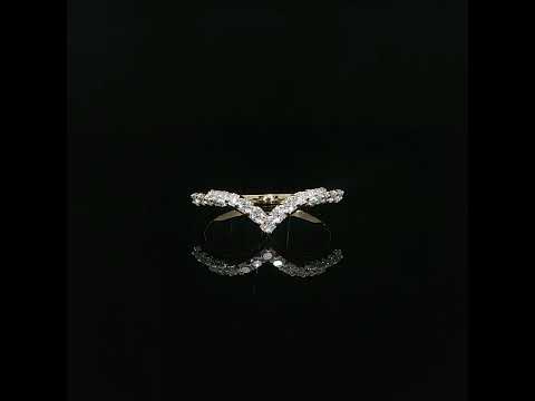 Yellow gold V-shaped contour band with 0.29 carats of lab-grown diamonds on a reflective black surface.