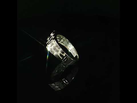 Detailed view of a men's 14K yellow gold nugget ring featuring an 8mm rectangular top with an irregular raised geometric design.