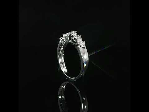 Polished white gold shoulder beside a row of raised diamond clusters, shown at a low angle.