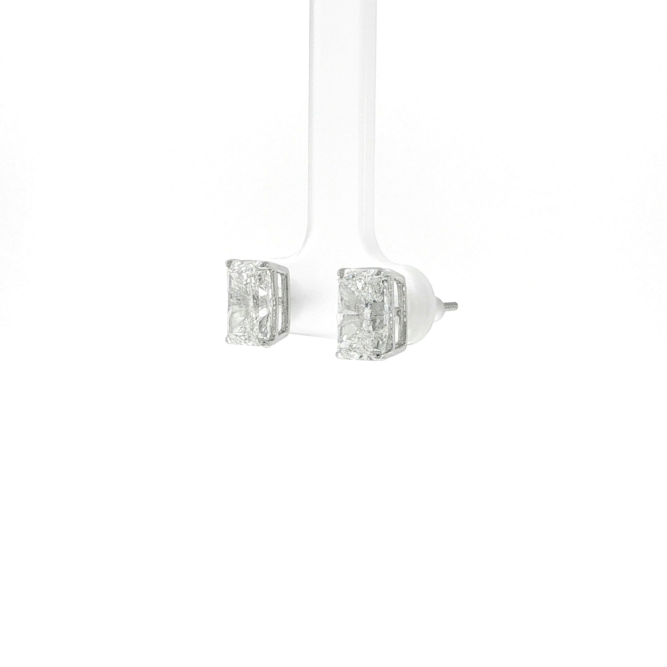 Close-up of radiant cut lab grown diamond earrings in 14K gold