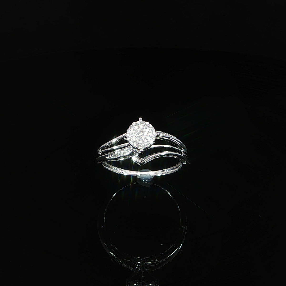 Angled front view of a 10K gold 0.07 CTW pavé composite engagement ring with polished and diamond-accented shoulders.