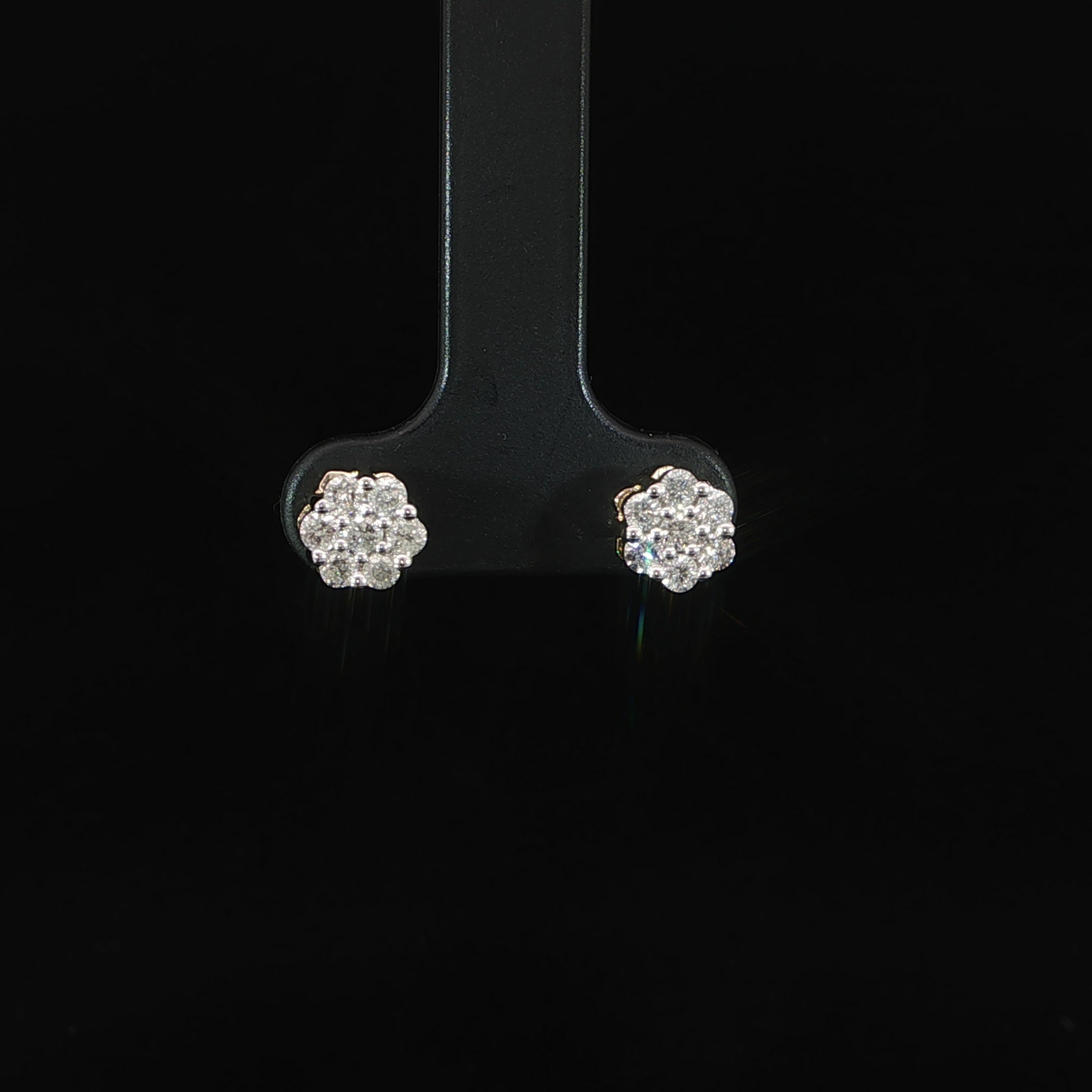 Close-up of SI-quality natural diamond cluster stud earrings