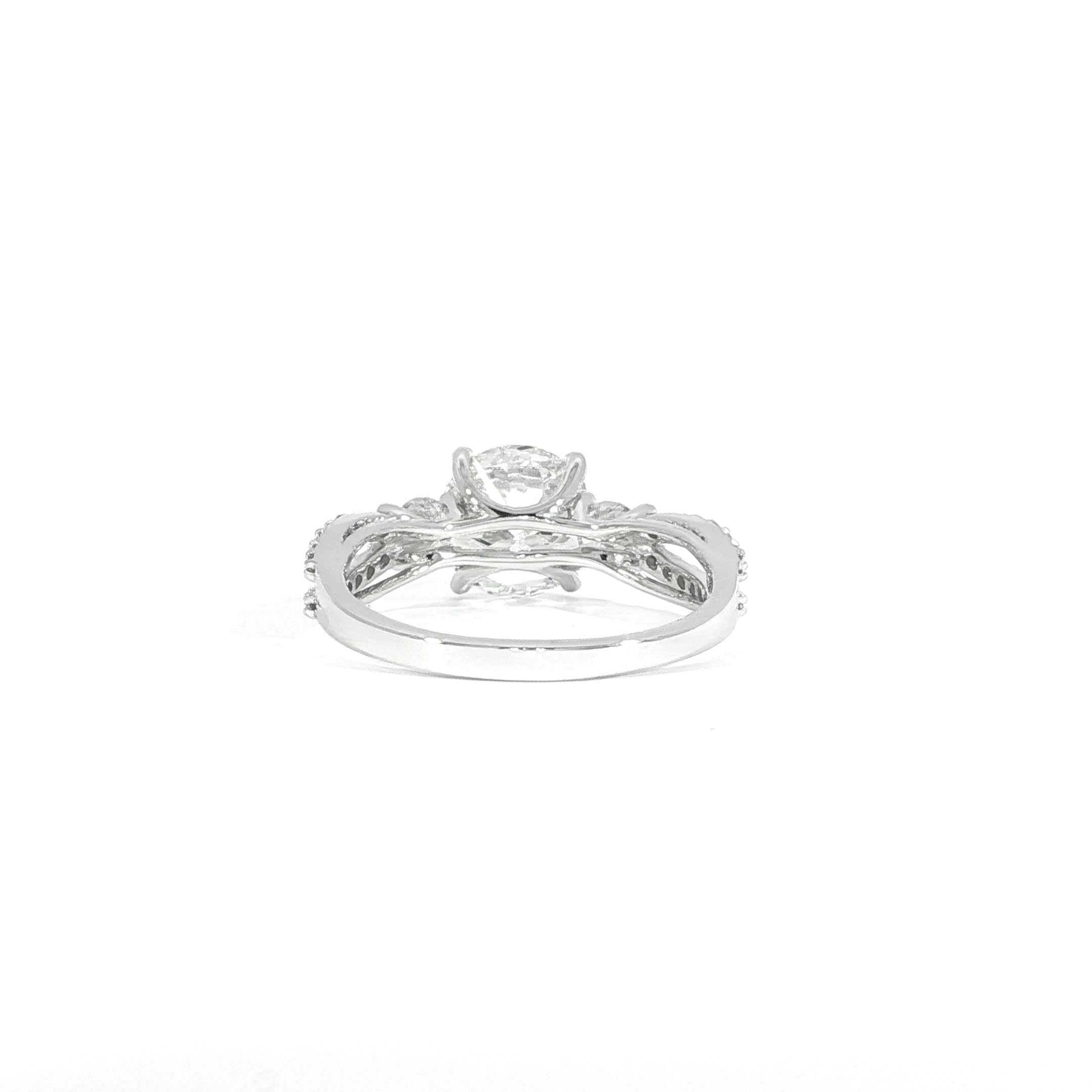Back view of diamond ring with side stones and split shank design