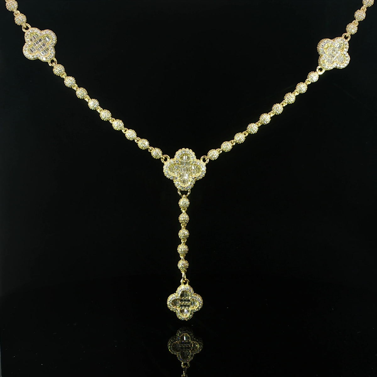 Front view of a sterling silver iced clover lariat necklace