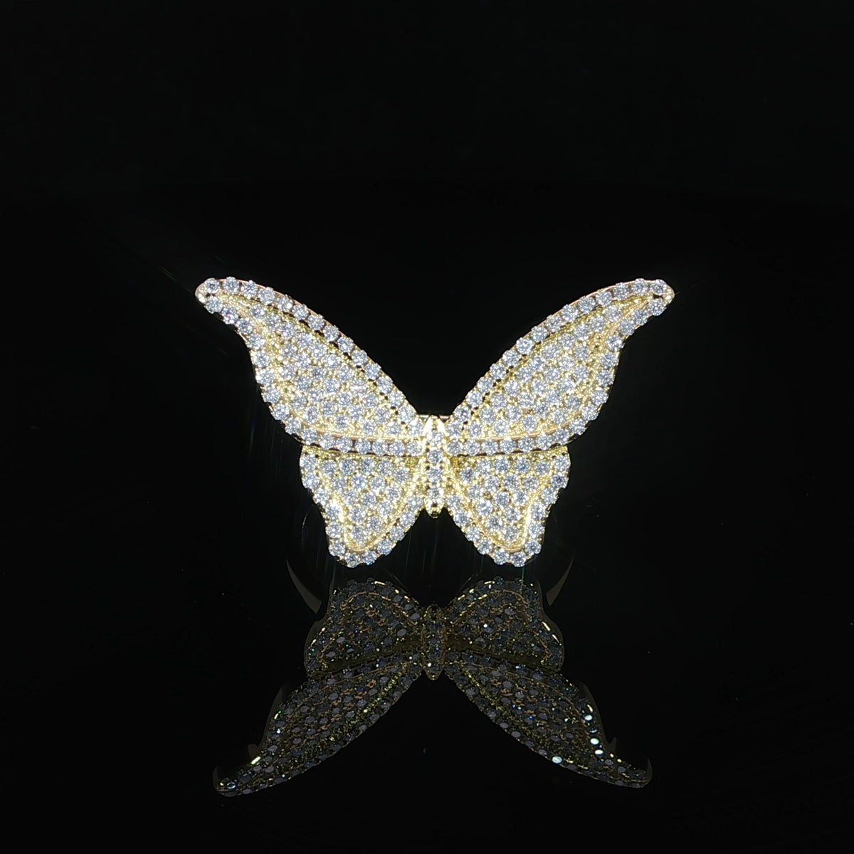 Front view of an open-winged butterfly ring in sterling silver