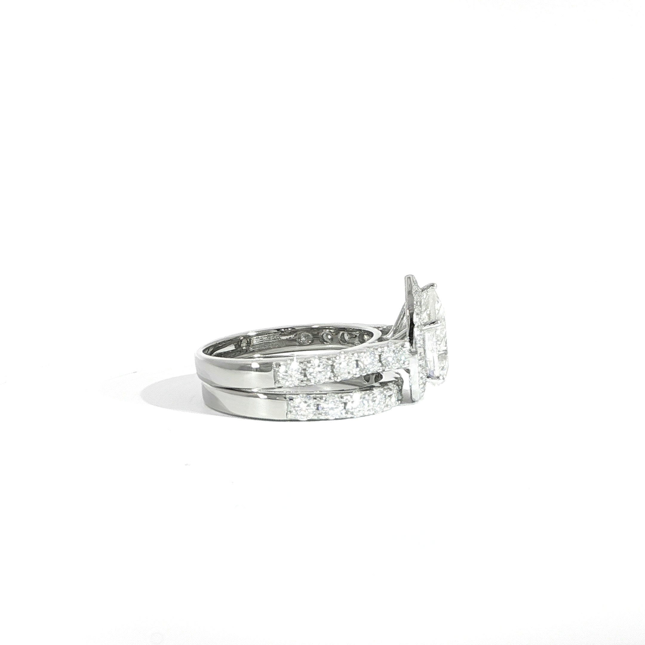 Side view of pear halo moissanite ring with matching band in 925 silver