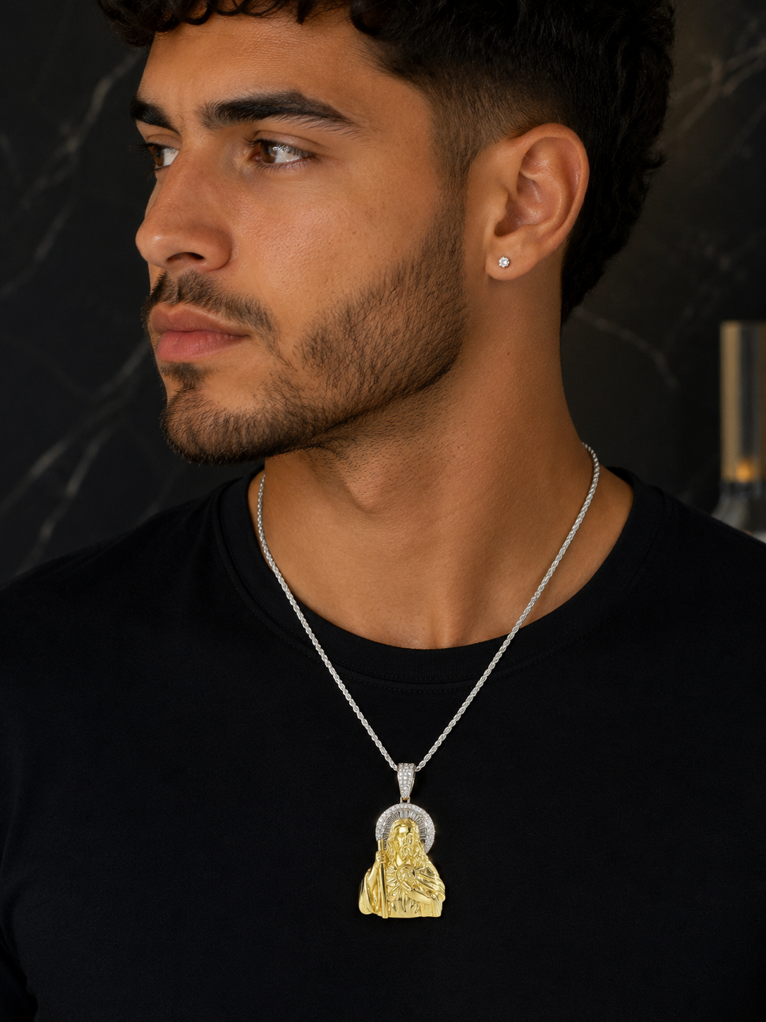 Model wearing gold plated sterling silver Jesus pendant with iced bail and radiant moissanite halo.