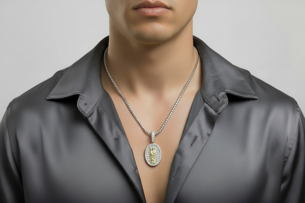 Two-tone Saint Jude oval pendant in sterling silver with VVS moissanite baguette accents.