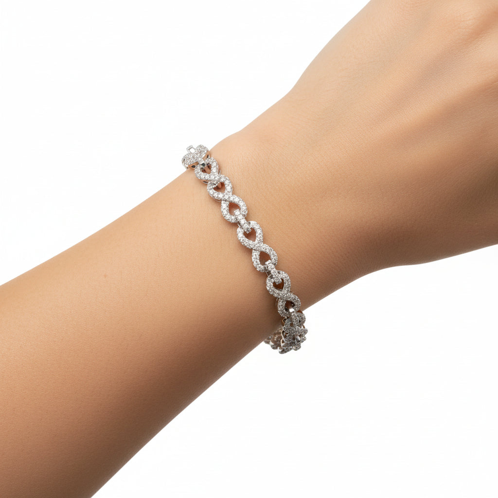 Sterling silver VVS moissanite infinity bracelet featuring 2.63 CTW of sparkling stones and a 5MM infinity link design.