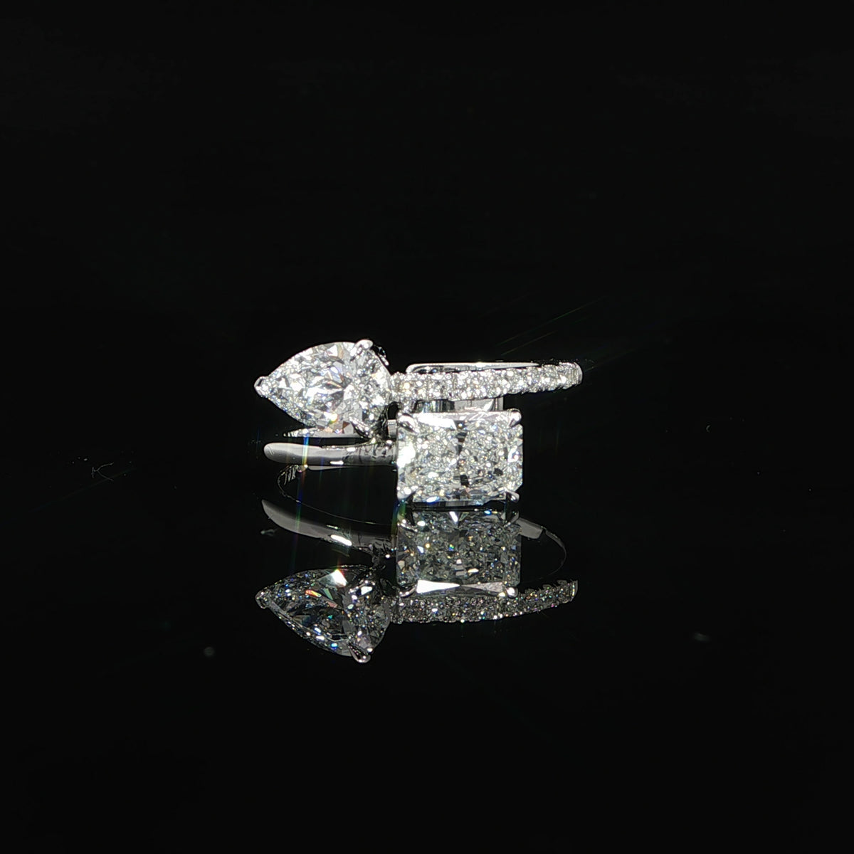 Toi et Moi engagement ring with radiant and pear lab grown diamonds set in 14K white gold.