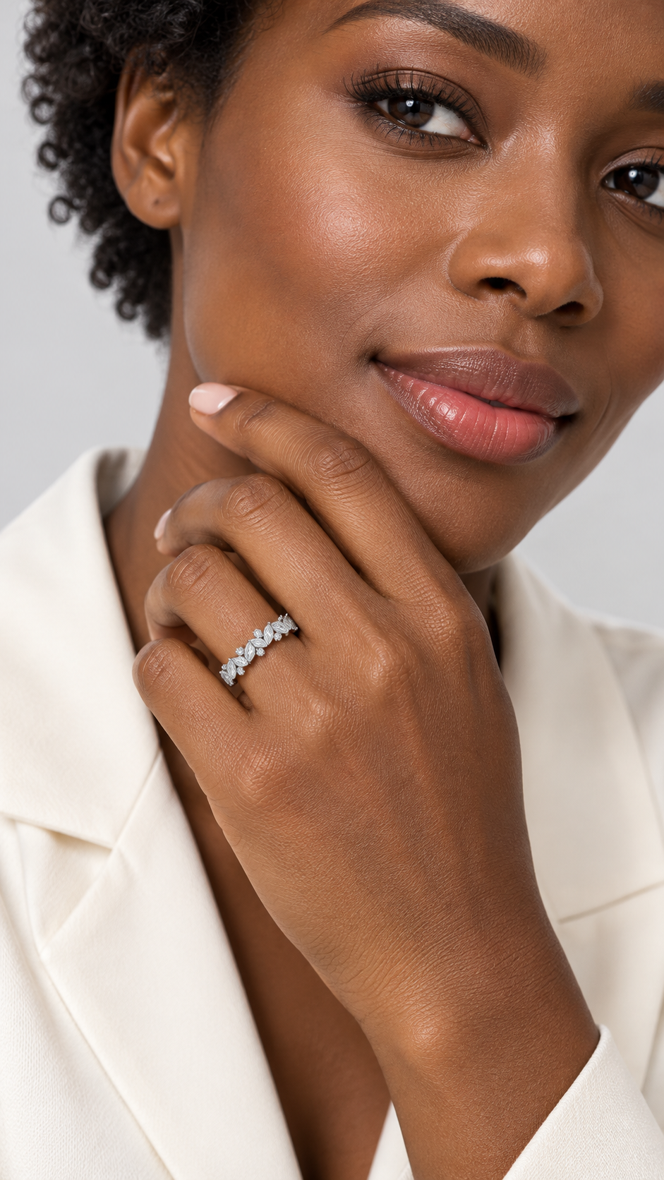 Model wearing 14K white gold multi-shape diamond band with a staggered arrangement of stones.