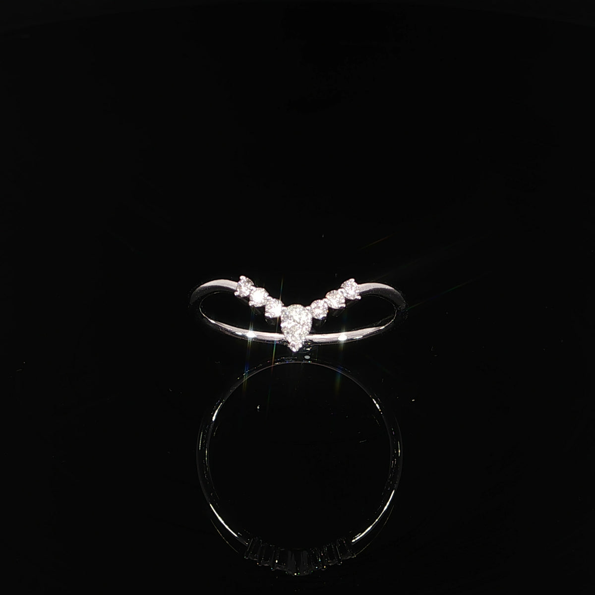 Elegant V-shaped diamond wedding band in 14K white gold featuring sparkling lab grown diamond accents and a delicate curved silhouette.