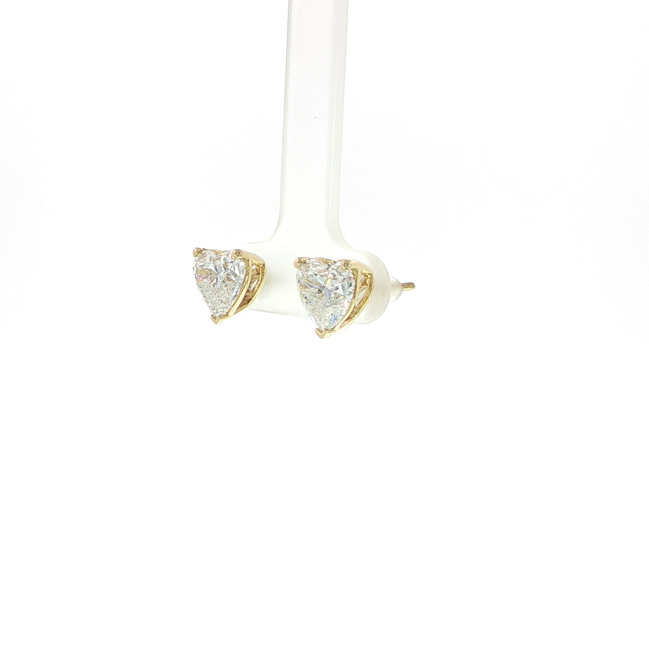 Women's heart shaped diamond stud earrings with secure screw backs